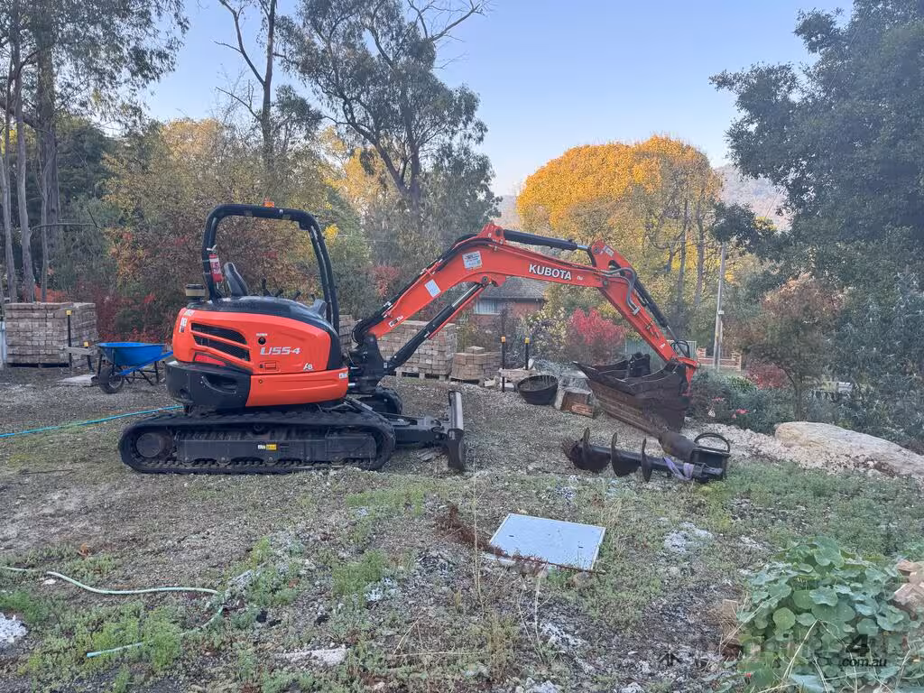 Kubota U55-4 excavator on a utility construction site